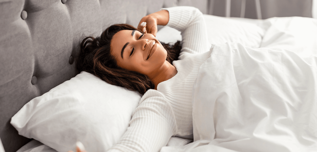 perimenopausal woman laying on grounding sheet