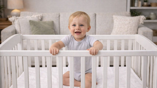 baby in a grounding bedsheet crib