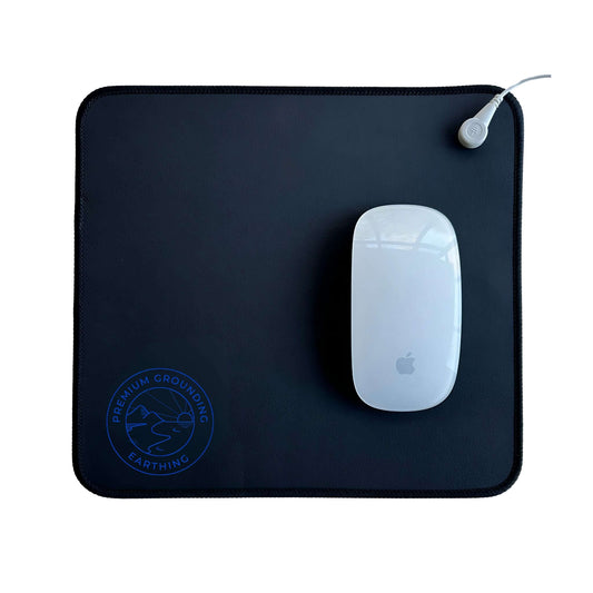 Person using computer with Grounding Mouse Pad